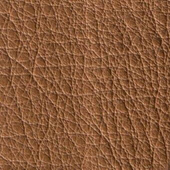 Brown leather texture with a heavily pebbled grain, displaying natural hide imperfections and a matte finish; verzelloni leather grade 313.